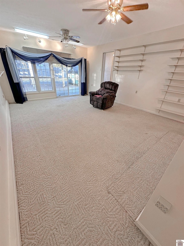 unfurnished room featuring carpet flooring and ceiling fan