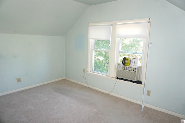 bonus room with cooling unit, lofted ceiling, and light carpet