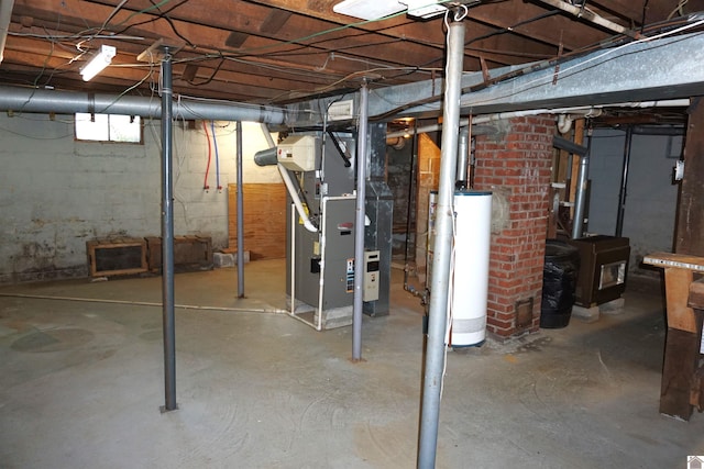 basement featuring heating unit and gas water heater