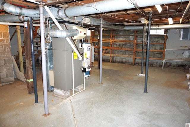 basement with electric panel, gas water heater, and heating unit