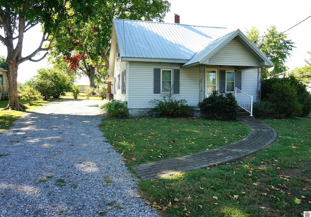 view of front of property with a porch and a front yard