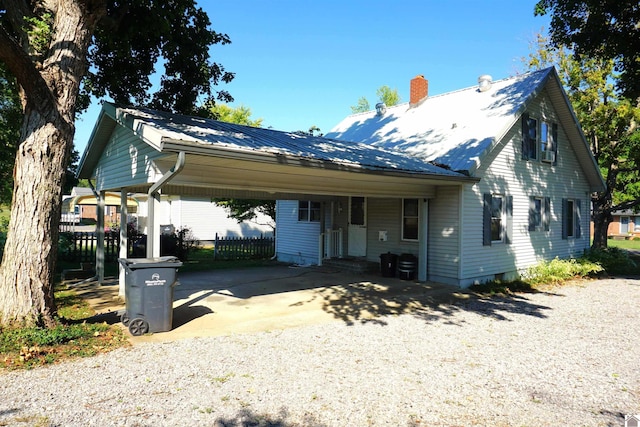 view of front of home featuring a carport