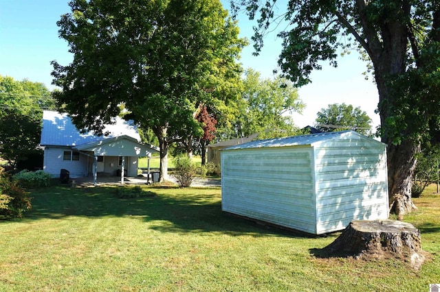 view of yard featuring a patio area and a storage unit