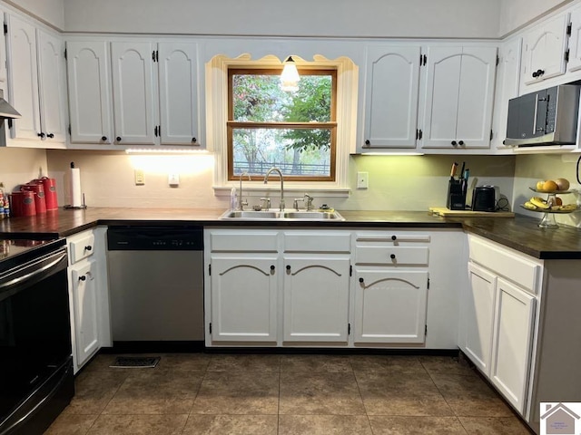 kitchen with sink, white cabinets, stainless steel appliances, and range hood