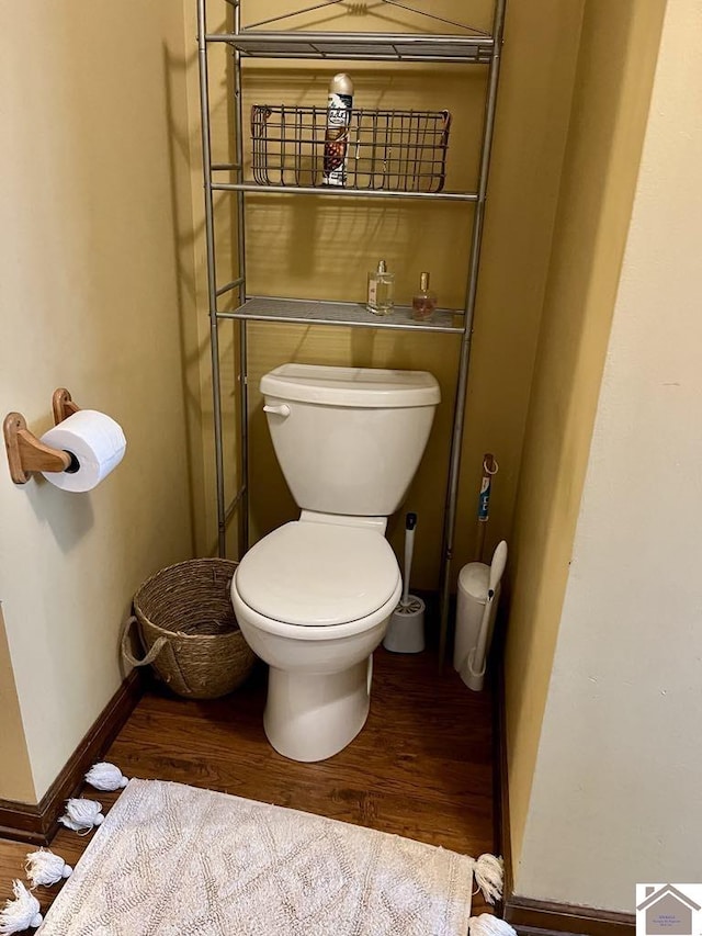 bathroom featuring hardwood / wood-style floors and toilet