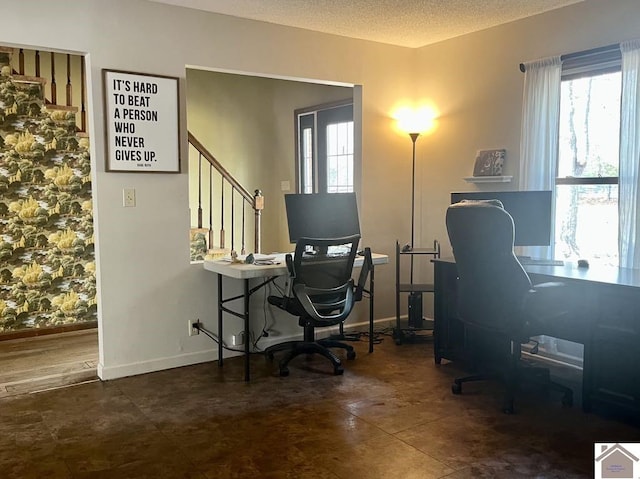 home office featuring a textured ceiling