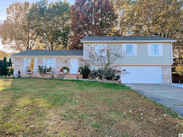 view of front of house featuring a garage and a front yard