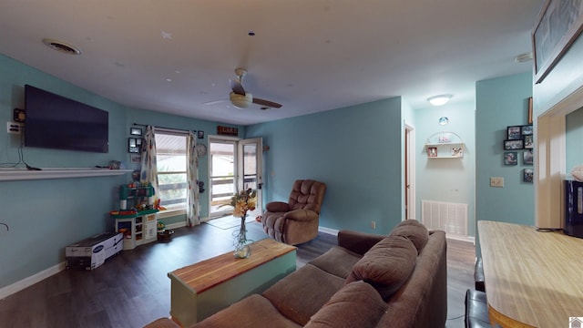 living room featuring french doors, ceiling fan, and dark wood-type flooring