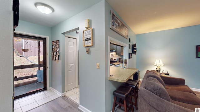 entryway with light tile patterned floors