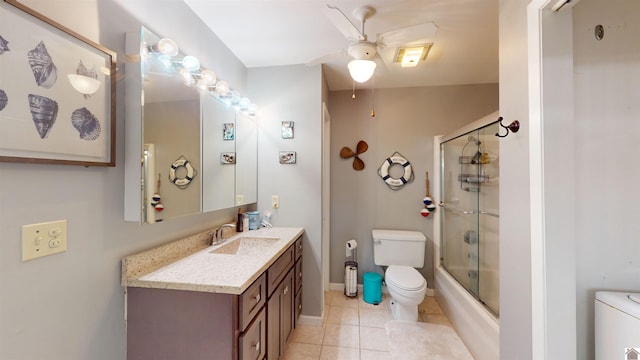 full bathroom featuring ceiling fan, tile patterned flooring, enclosed tub / shower combo, toilet, and vanity