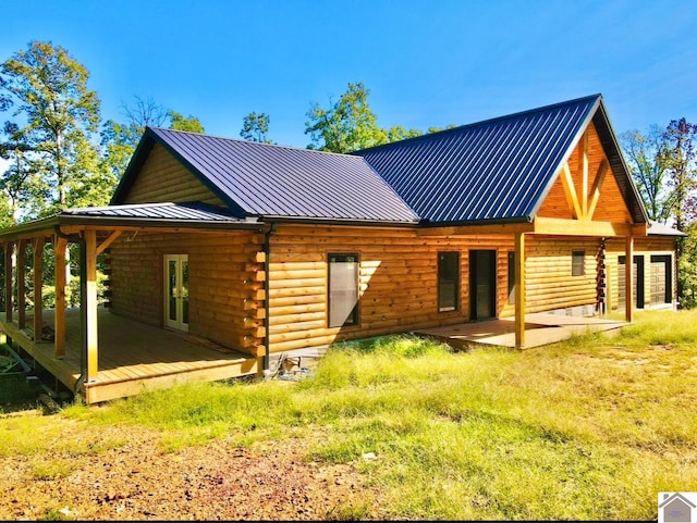 back of house with a patio area and french doors