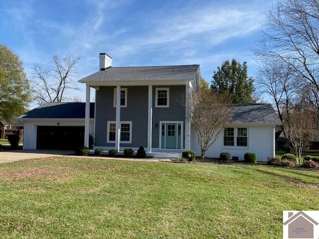 view of front facade featuring a garage and a front yard