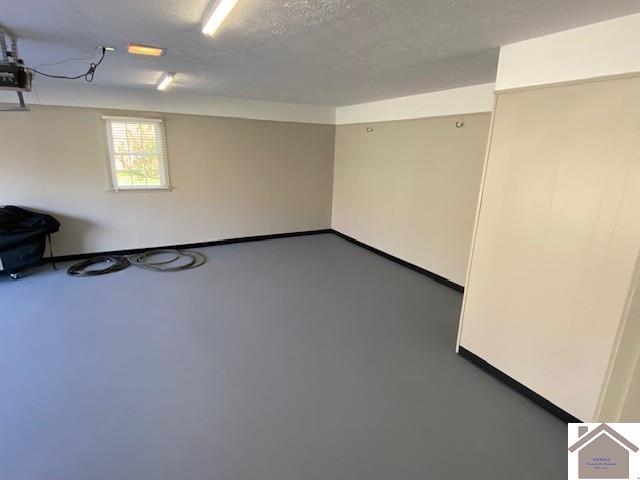 basement with a textured ceiling