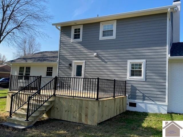 back of property featuring a deck