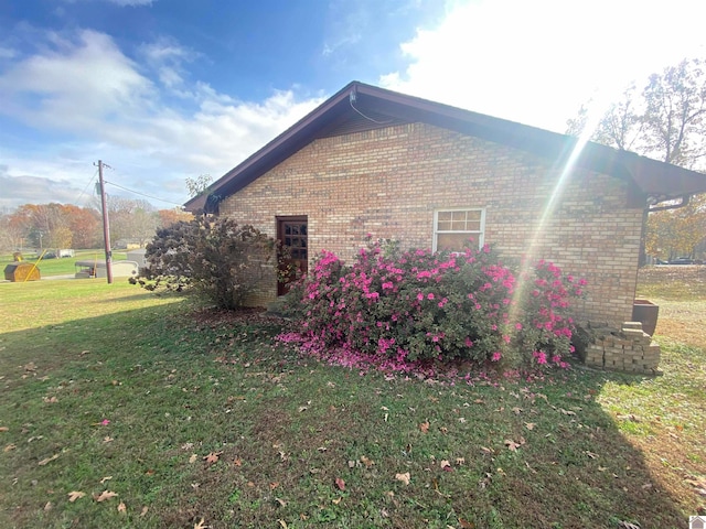 view of property exterior with a yard