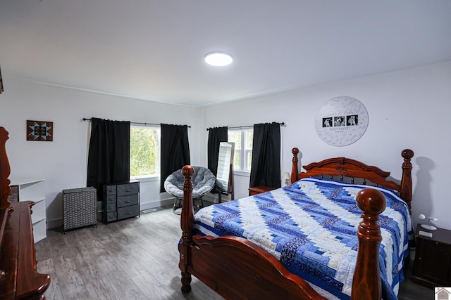 bedroom with wood-type flooring