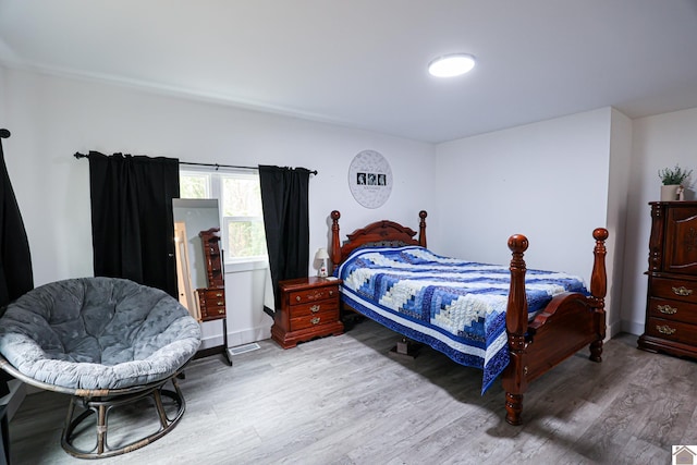 bedroom with light hardwood / wood-style floors