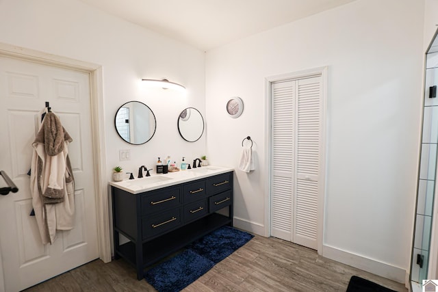 bathroom featuring vanity and hardwood / wood-style flooring