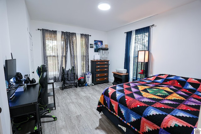 bedroom with wood-type flooring