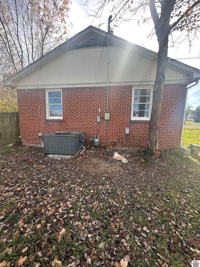 view of side of home featuring cooling unit