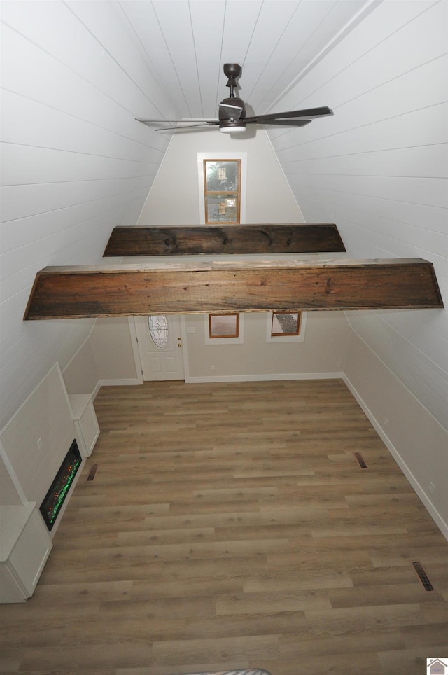 bonus room with dark hardwood / wood-style floors and ceiling fan