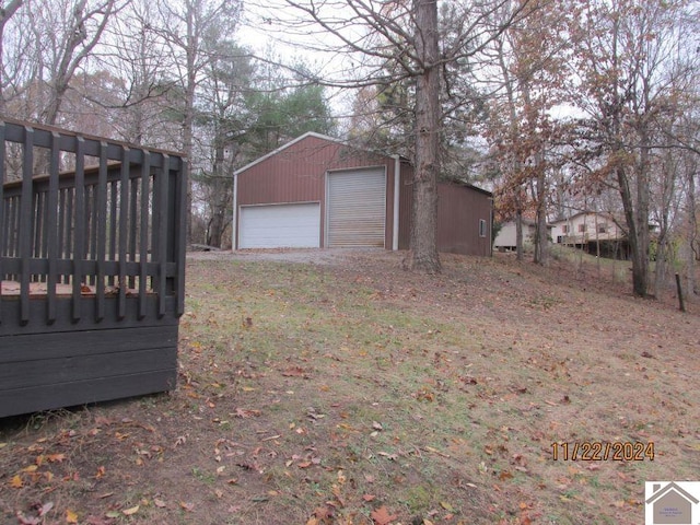 exterior space with a garage and an outdoor structure