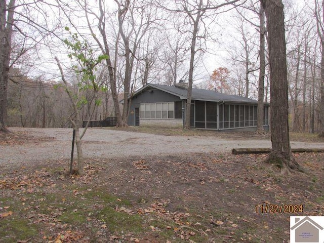 view of front facade featuring a sunroom