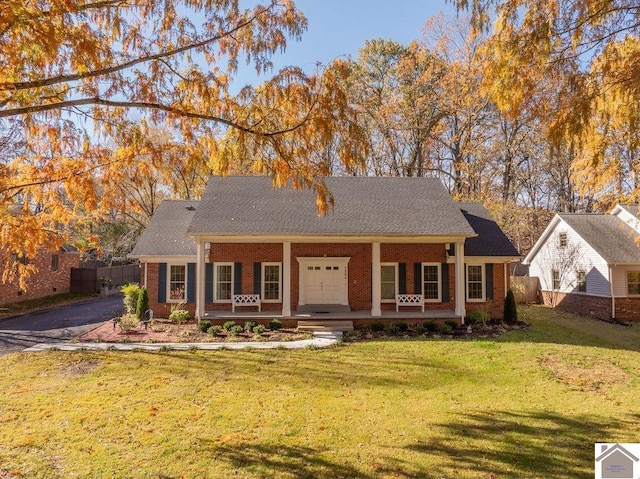 view of front facade with covered porch and a front lawn