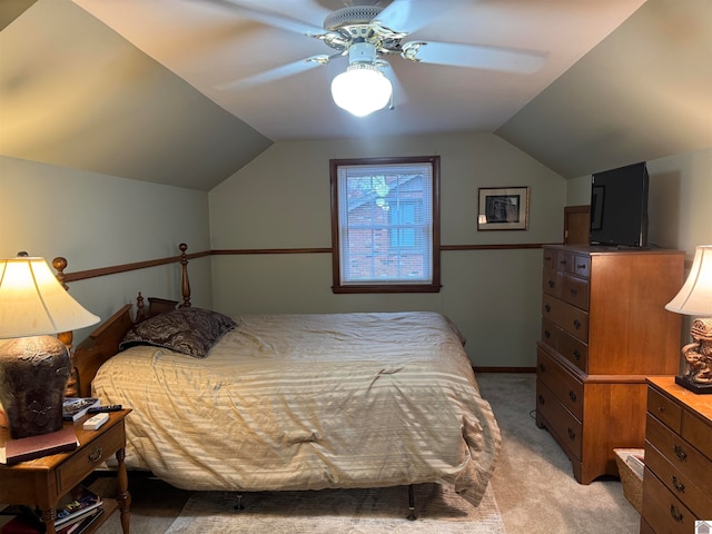 bedroom featuring ceiling fan, light colored carpet, and lofted ceiling