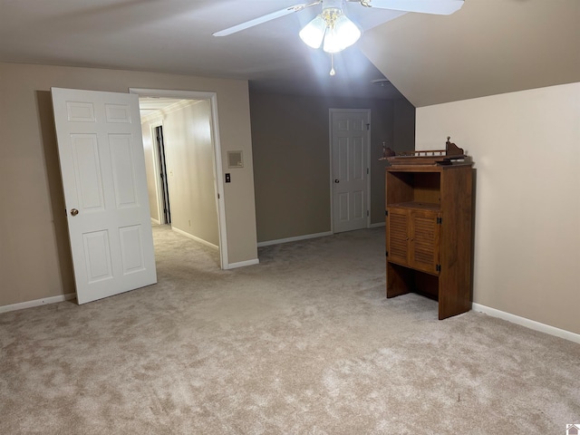 interior space with vaulted ceiling and ceiling fan