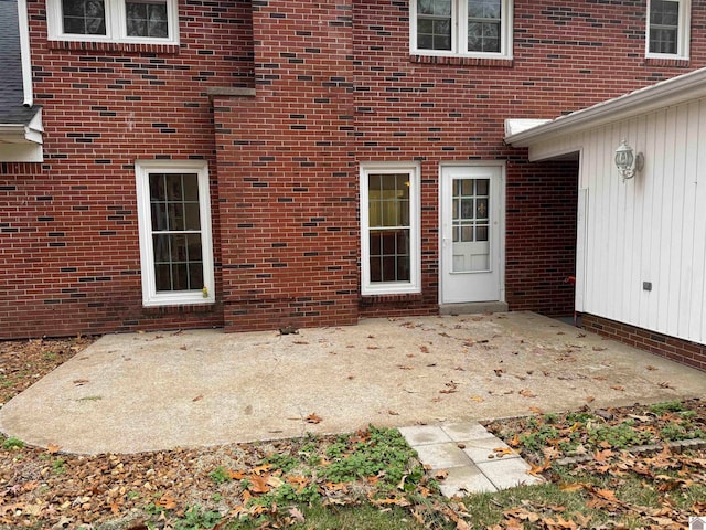 entrance to property with a patio