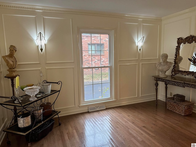 doorway with hardwood / wood-style flooring