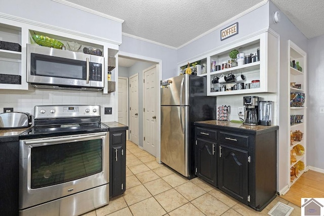 kitchen featuring decorative backsplash, a textured ceiling, stainless steel appliances, crown molding, and light tile patterned floors