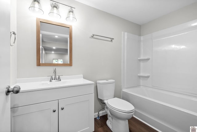 full bathroom with toilet, vanity, shower / bath combination, and hardwood / wood-style flooring