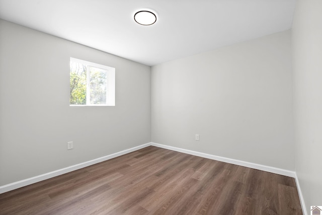 unfurnished room with wood-type flooring