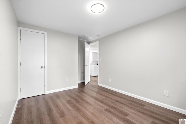 spare room featuring wood-type flooring