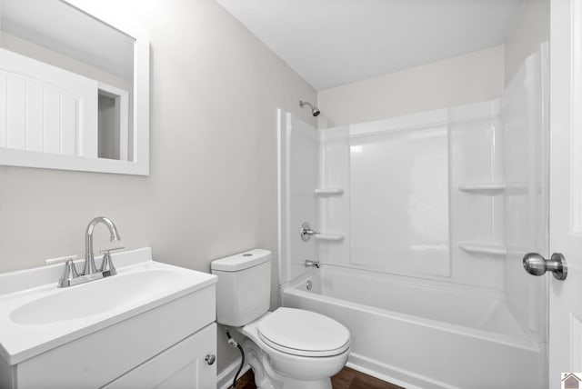 full bathroom featuring hardwood / wood-style flooring, vanity, shower / bathtub combination, and toilet