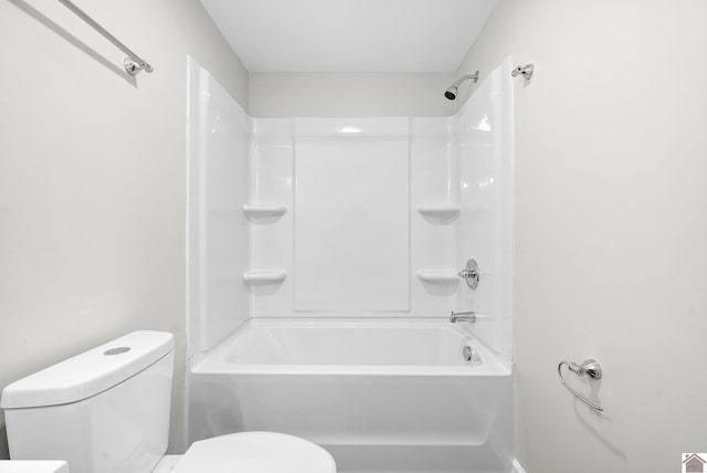 bathroom featuring toilet and shower / tub combination