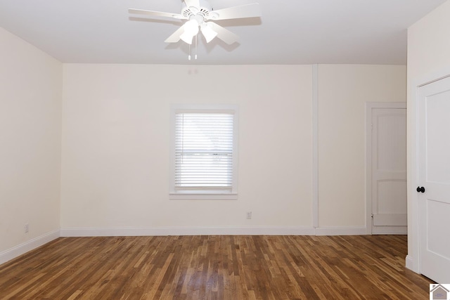 spare room featuring ceiling fan and dark wood-type flooring