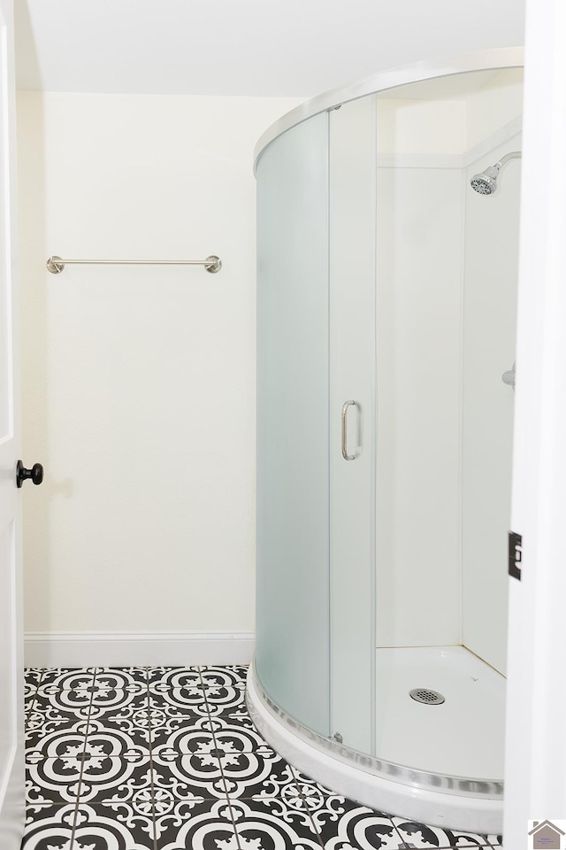 bathroom featuring tile patterned flooring and walk in shower