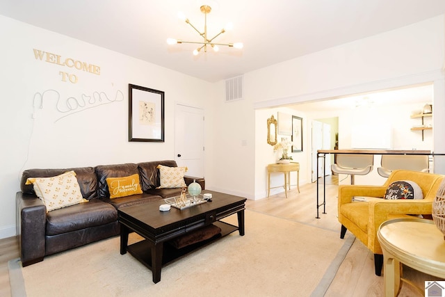 living room featuring a notable chandelier