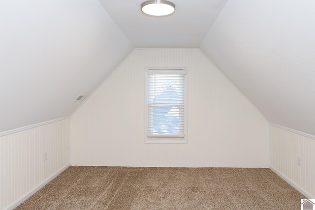 bonus room with carpet and lofted ceiling