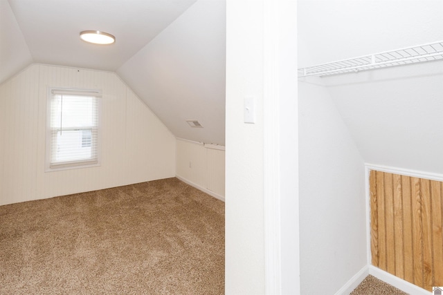 bonus room featuring carpet and lofted ceiling