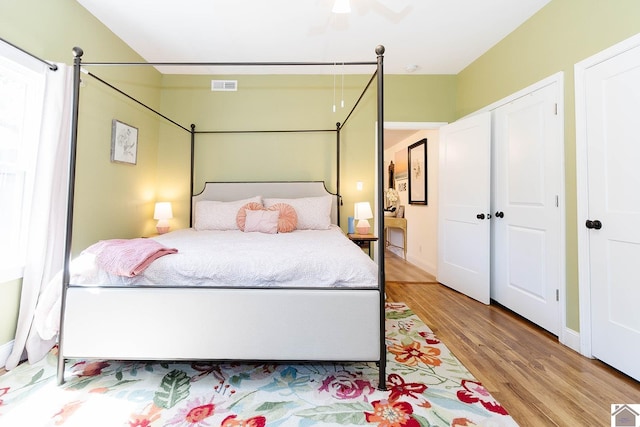 bedroom featuring ceiling fan and light wood-type flooring