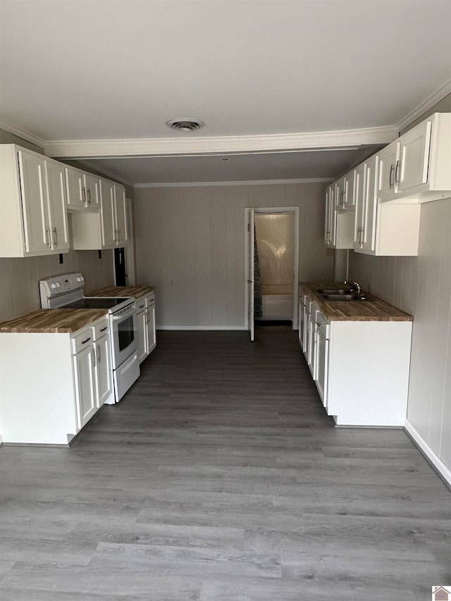 kitchen featuring electric range, white cabinets, ornamental molding, and hardwood / wood-style floors