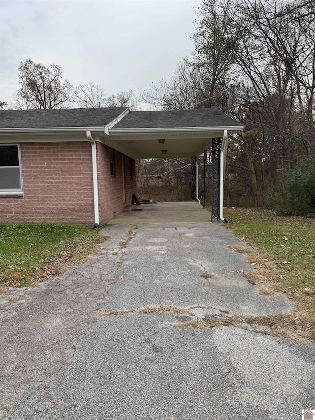 view of car parking featuring a carport