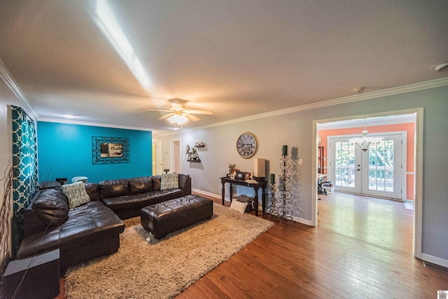 living room featuring hardwood / wood-style floors, french doors, and ornamental molding