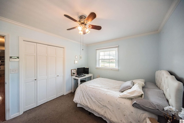 bedroom with dark colored carpet, ceiling fan, crown molding, and a closet