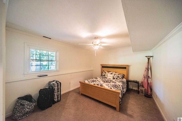 carpeted bedroom with ceiling fan and crown molding