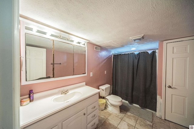 full bathroom featuring shower / bathtub combination with curtain, tile patterned floors, a textured ceiling, toilet, and vanity